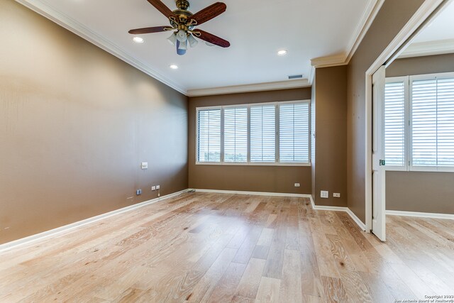 unfurnished room with ceiling fan, light hardwood / wood-style flooring, and ornamental molding