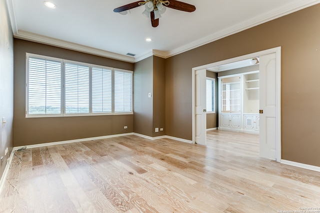 unfurnished room featuring crown molding, light hardwood / wood-style floors, and ceiling fan