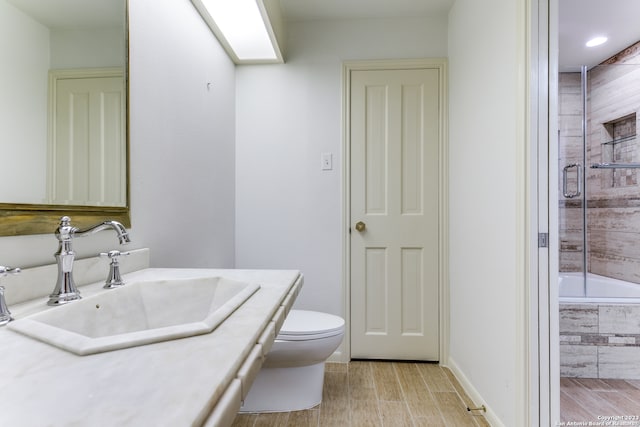 bathroom with toilet and vanity with extensive cabinet space