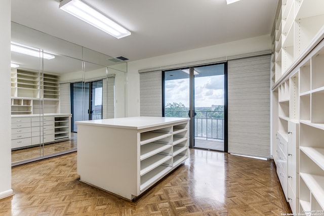 walk in closet featuring light parquet floors