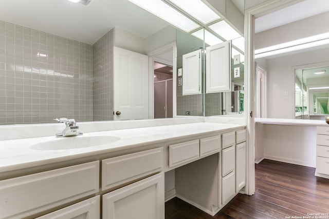 bathroom featuring vanity and hardwood / wood-style flooring