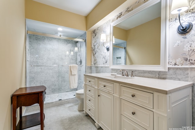 bathroom with toilet, vanity, tile walls, tile flooring, and an enclosed shower