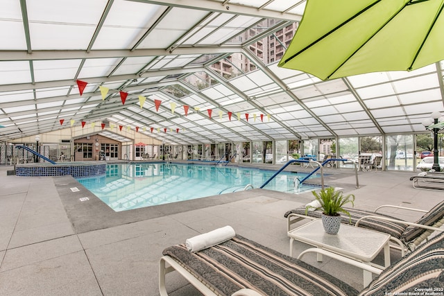 view of swimming pool with a patio area