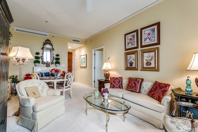 carpeted living room featuring ornamental molding