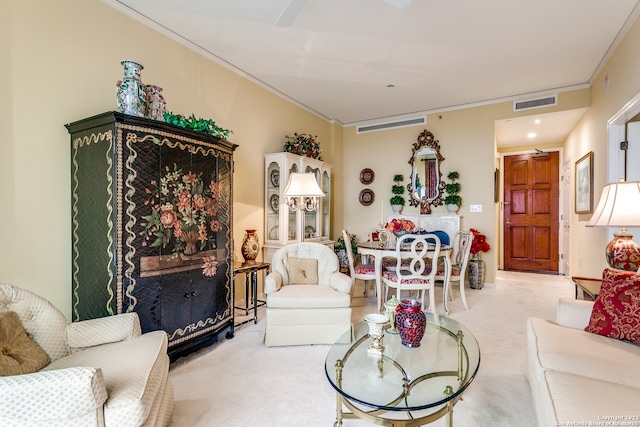 living room with light carpet and crown molding