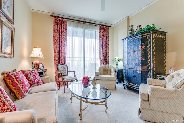 carpeted living room with ornamental molding