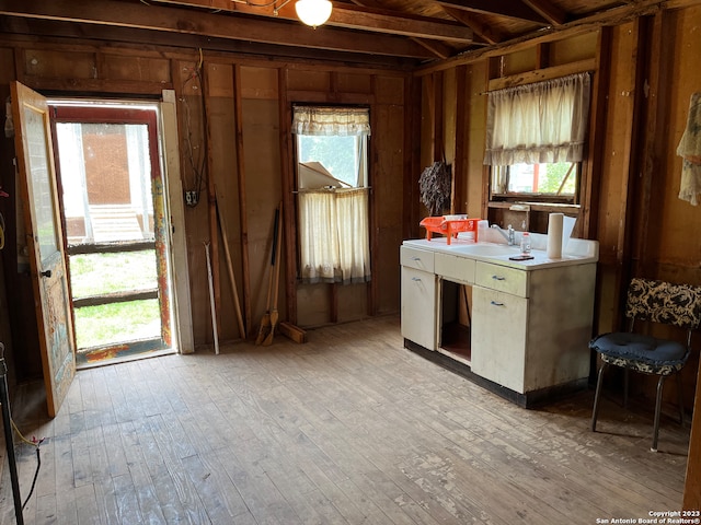 interior space featuring sink and light hardwood / wood-style flooring