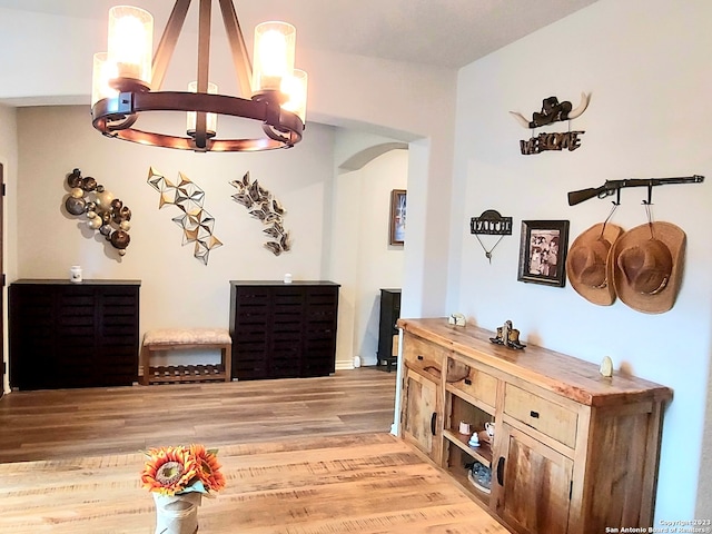 dining space with a notable chandelier and light wood-type flooring