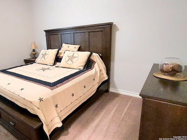 bedroom with dark colored carpet