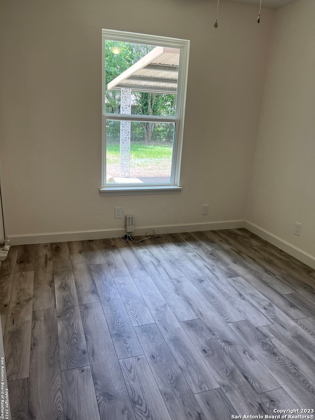 unfurnished room featuring light wood-type flooring