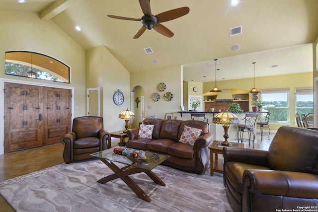 living room featuring light tile flooring, ceiling fan, high vaulted ceiling, and beamed ceiling