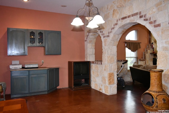 interior space with an inviting chandelier and dark wood-type flooring