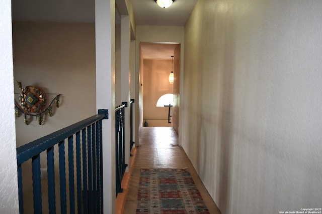 hallway with light hardwood / wood-style flooring