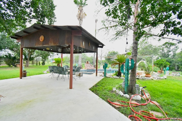 view of nearby features with a lawn, a patio, and a gazebo