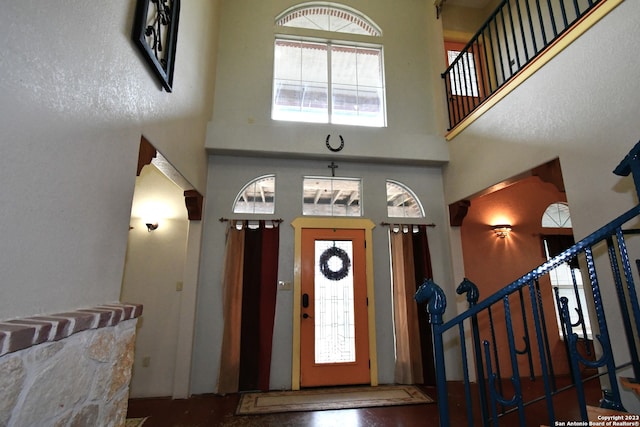 entryway with a towering ceiling