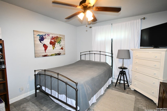 tiled bedroom with ceiling fan