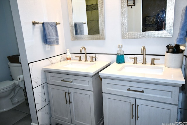 bathroom with toilet and vanity