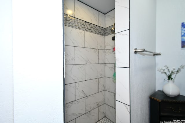 bathroom with a tile shower