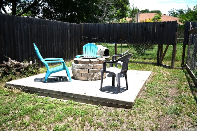 view of terrace with a fire pit