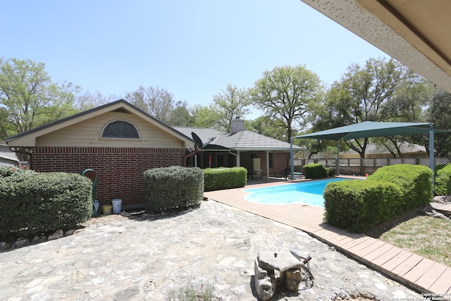 view of swimming pool featuring a patio