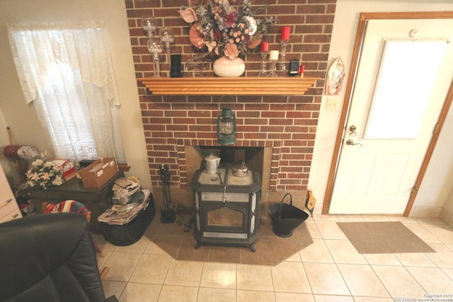 tiled living room with a healthy amount of sunlight and a fireplace