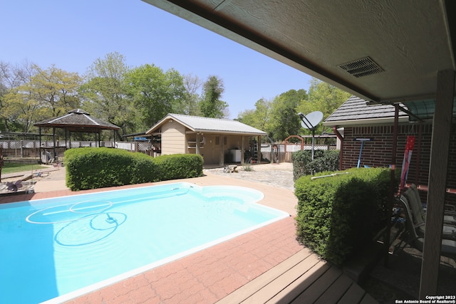 view of pool featuring a patio area and a gazebo