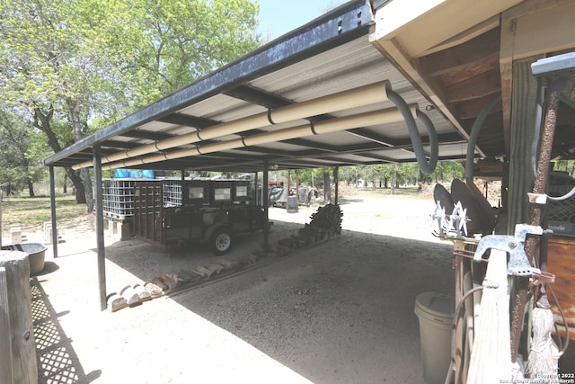 view of parking / parking lot with a carport