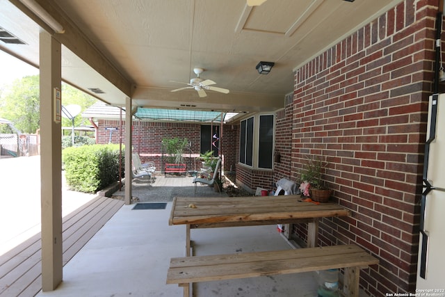 view of terrace featuring ceiling fan