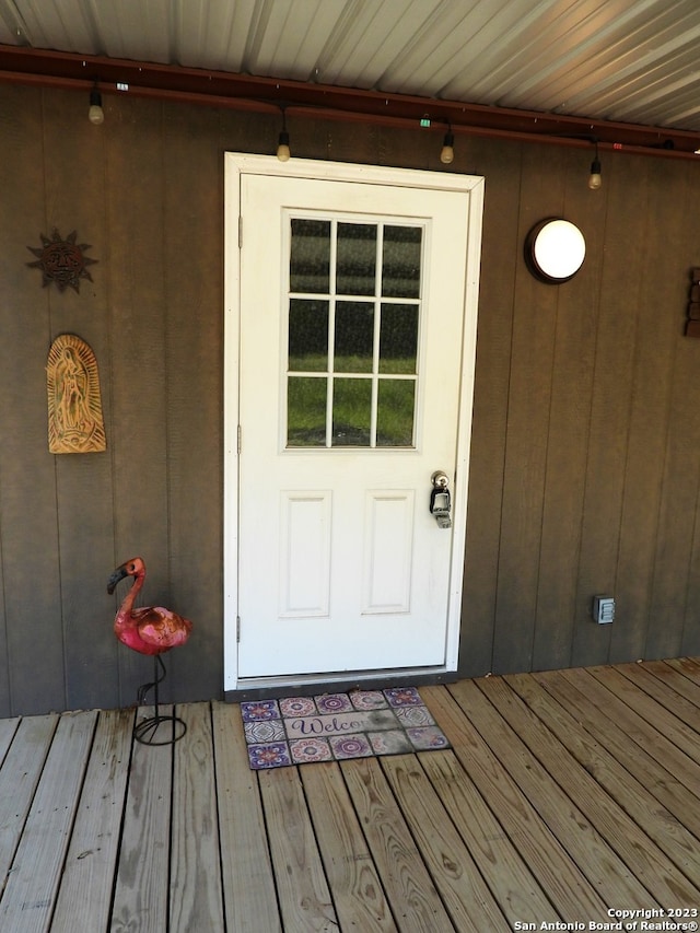 doorway to property with a deck