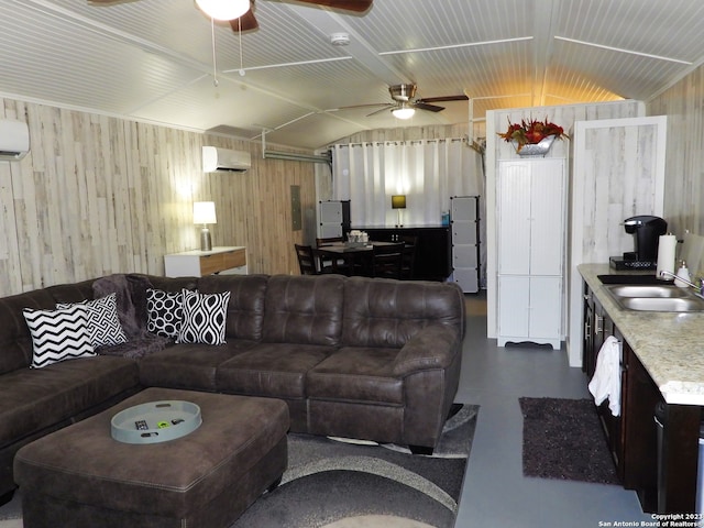 living room featuring ceiling fan, lofted ceiling, sink, and a wall mounted air conditioner