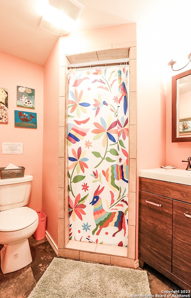 bathroom with vanity and toilet