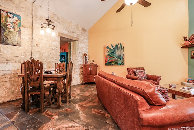 tiled living room featuring high vaulted ceiling and ceiling fan