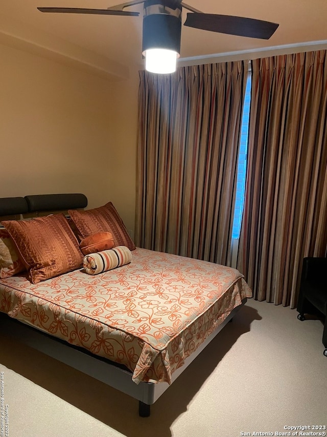 bedroom with carpet floors and ceiling fan