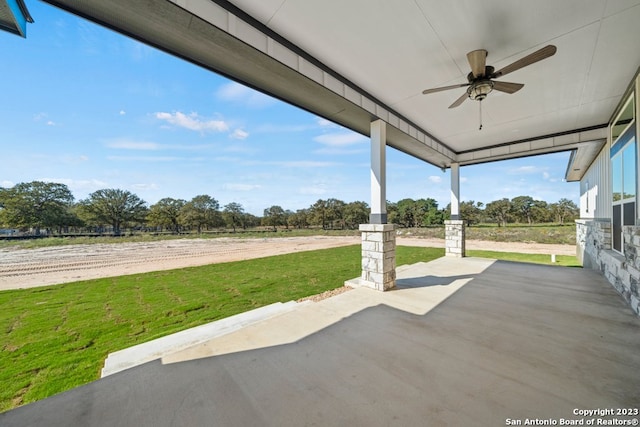 view of patio featuring ceiling fan