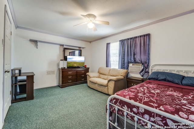 carpeted bedroom featuring crown molding and ceiling fan