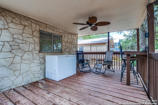 wooden terrace with ceiling fan