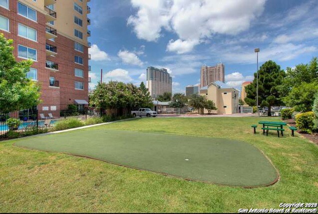 view of home's community featuring a lawn