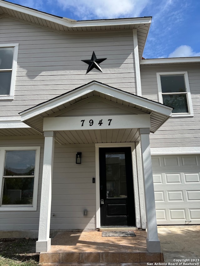 entrance to property featuring a garage