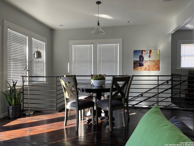 dining area featuring a chandelier and dark hardwood / wood-style flooring