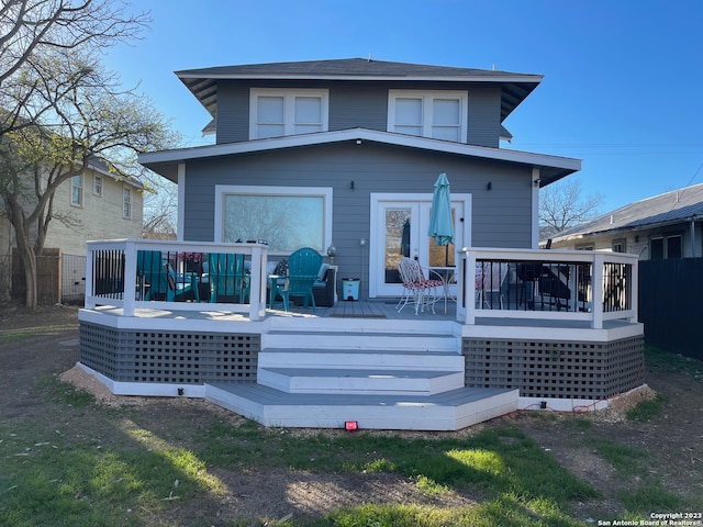 back of house with a wooden deck