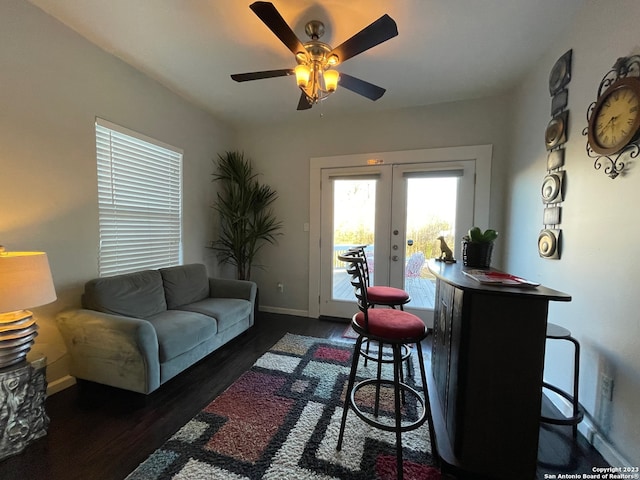 living room featuring french doors, ceiling fan, and dark wood-type flooring