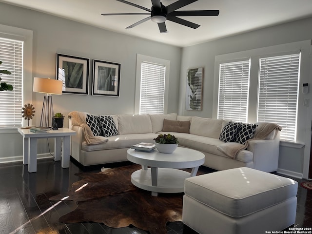 living room with ceiling fan, dark hardwood / wood-style floors, and a healthy amount of sunlight