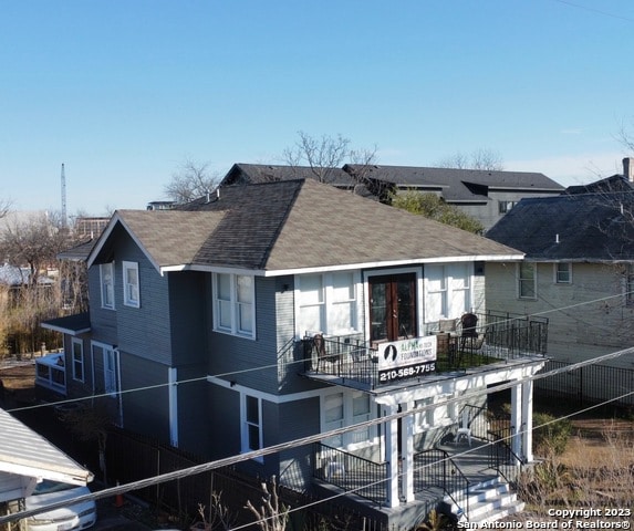 rear view of house with a balcony