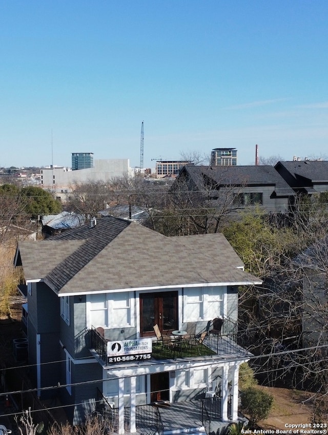 view of front of property with a balcony