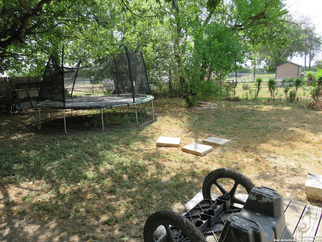 view of yard featuring a trampoline