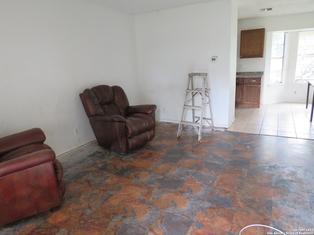 sitting room with light tile floors