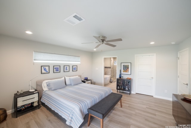 bedroom featuring ceiling fan, connected bathroom, and light hardwood / wood-style flooring