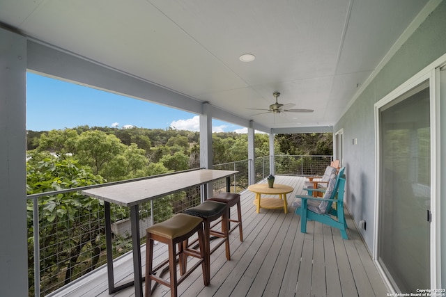 wooden deck with ceiling fan