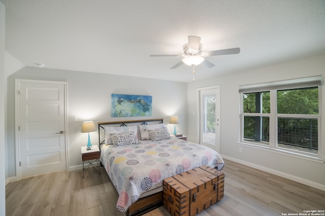 bedroom with ceiling fan and light hardwood / wood-style flooring