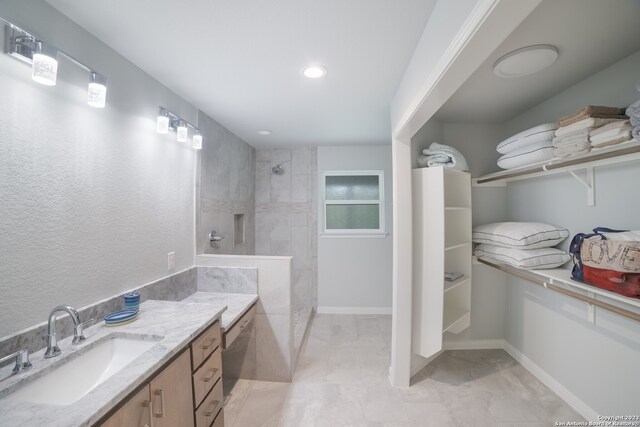 bathroom with vanity and tile floors